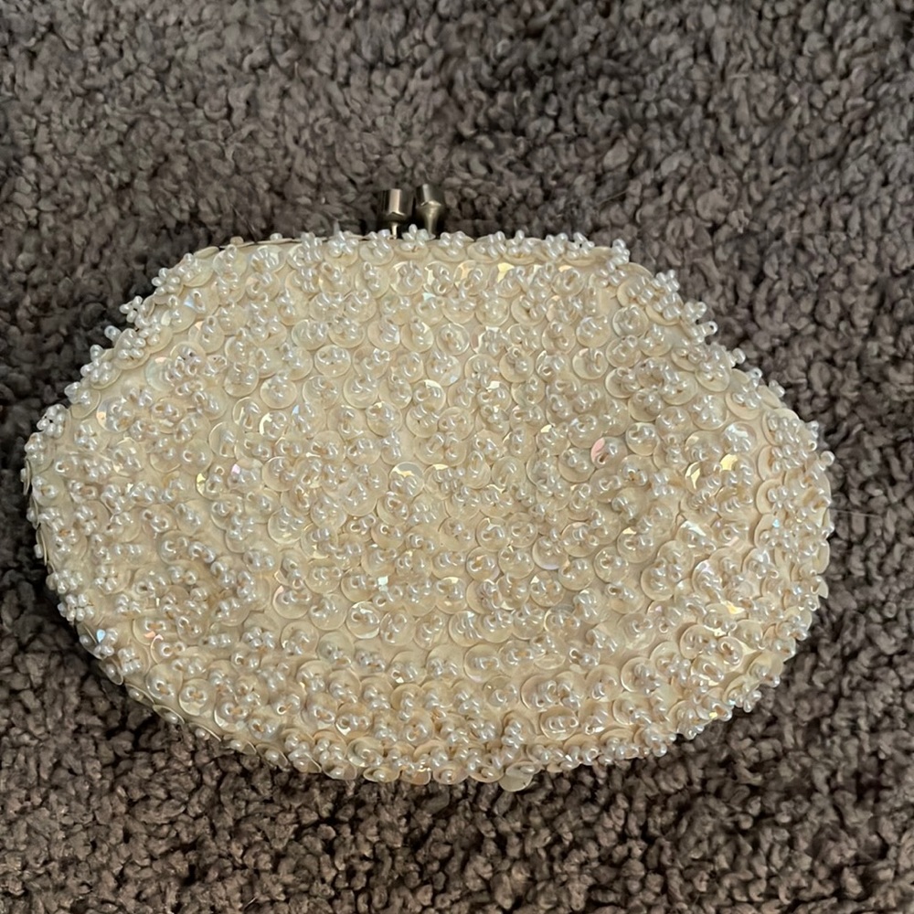 Small little coin purse with white beads made in Hong Kong
